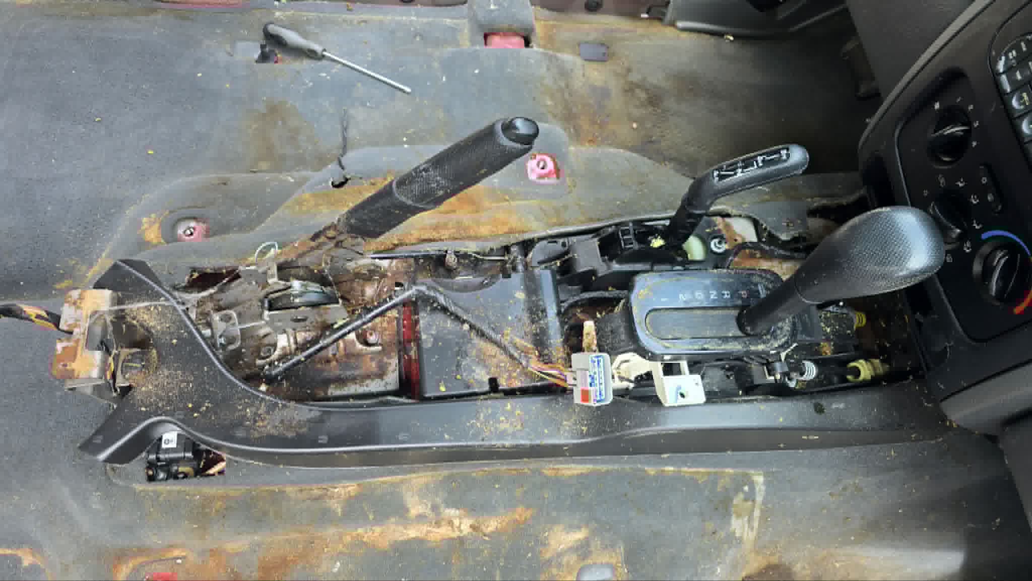 Center console removed, wiring exposed
