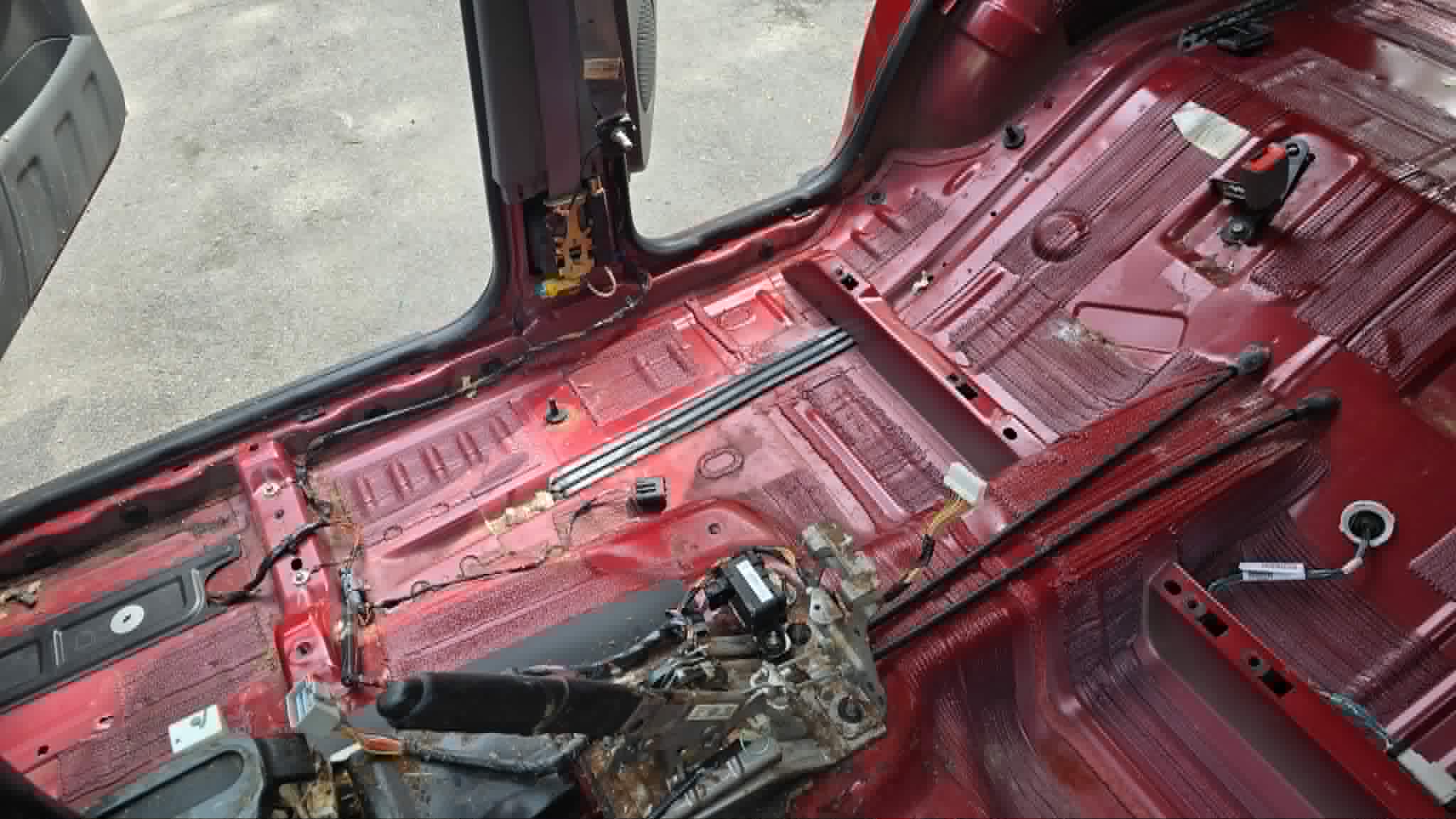 Vehicle stripped to the bare floor pan